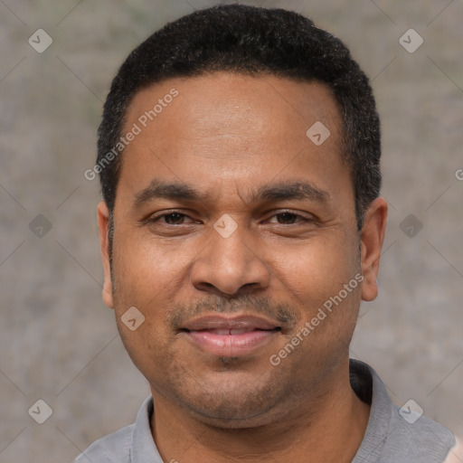 Joyful latino adult male with short  black hair and brown eyes