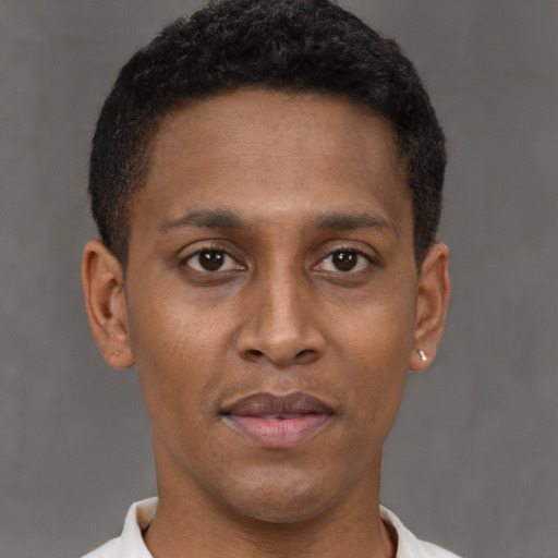 Neutral latino young-adult male with short  brown hair and brown eyes