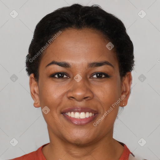 Joyful latino young-adult female with short  brown hair and brown eyes