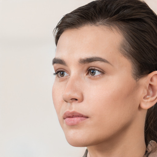 Neutral white young-adult female with medium  brown hair and brown eyes