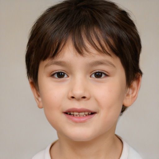 Joyful white child male with short  brown hair and brown eyes