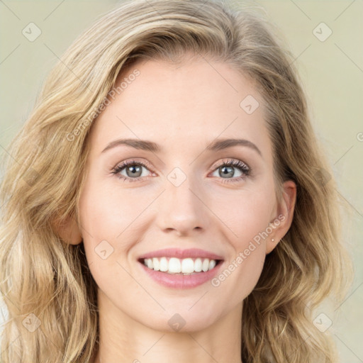 Joyful white young-adult female with long  brown hair and green eyes