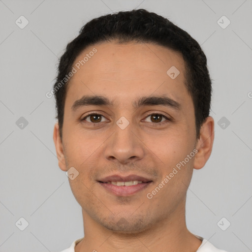 Joyful white young-adult male with short  black hair and brown eyes