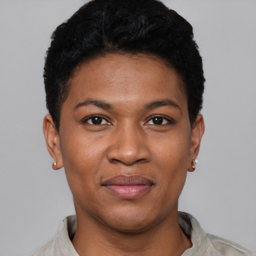 Joyful black young-adult female with short  black hair and brown eyes