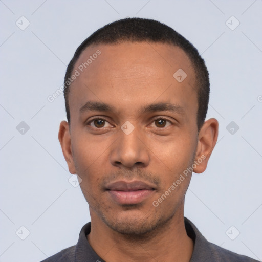 Neutral black young-adult male with short  black hair and brown eyes