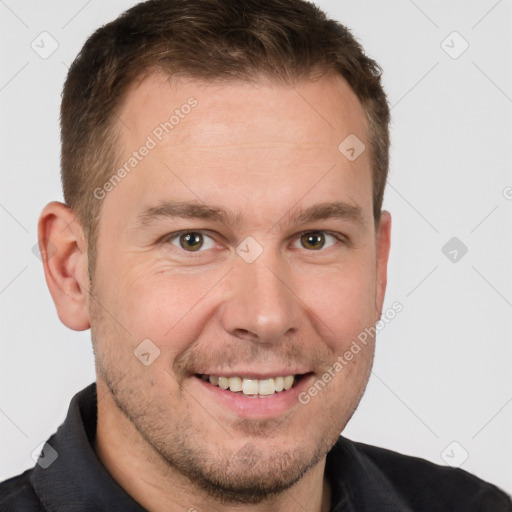 Joyful white adult male with short  brown hair and brown eyes