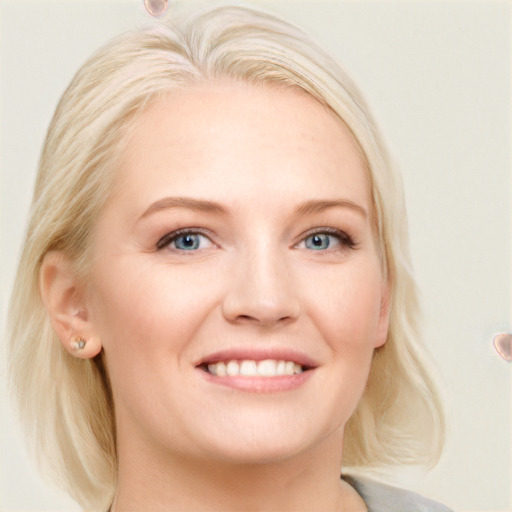 Joyful white young-adult female with medium  blond hair and blue eyes