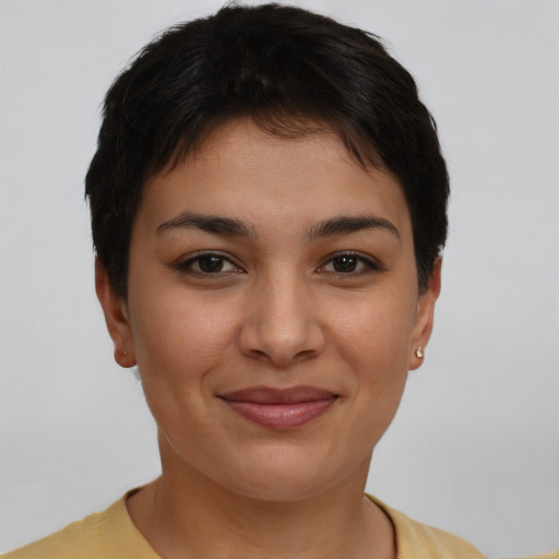 Joyful latino young-adult female with short  brown hair and brown eyes