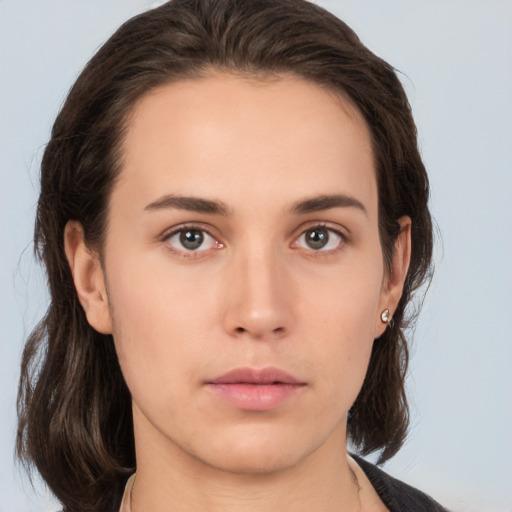 Neutral white young-adult female with medium  brown hair and brown eyes