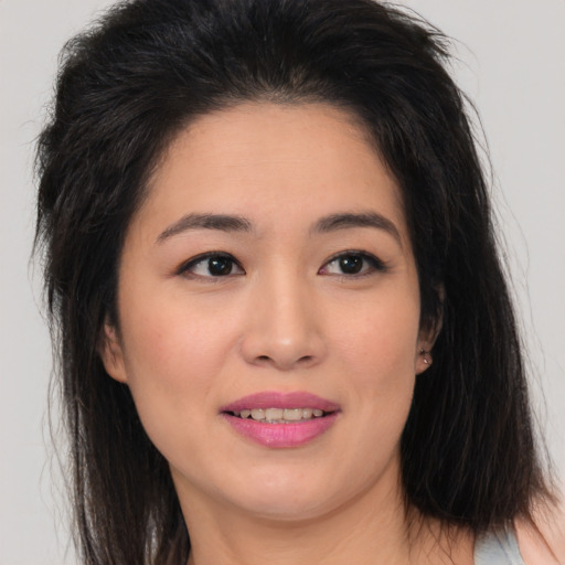 Joyful asian young-adult female with medium  brown hair and brown eyes