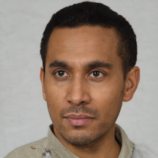 Neutral latino young-adult male with short  black hair and brown eyes