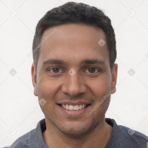 Joyful white young-adult male with short  black hair and brown eyes