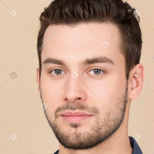 Neutral white young-adult male with short  brown hair and brown eyes