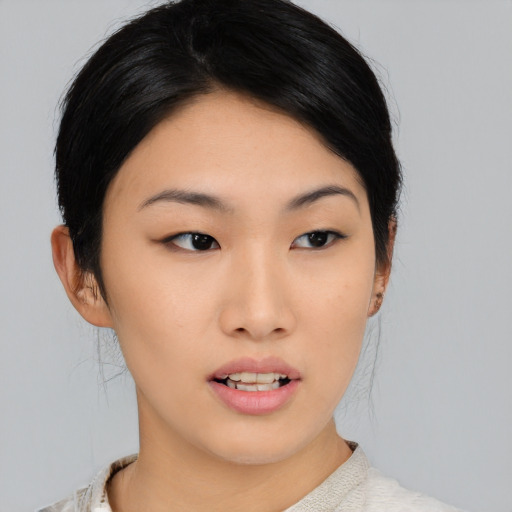 Neutral asian young-adult female with medium  black hair and brown eyes
