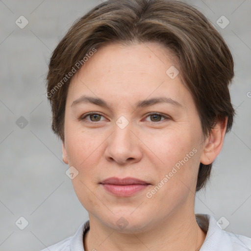 Joyful white adult female with short  brown hair and brown eyes