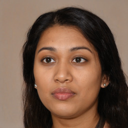 Neutral latino young-adult female with long  brown hair and brown eyes