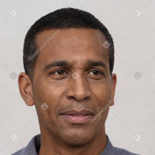 Joyful latino adult male with short  black hair and brown eyes