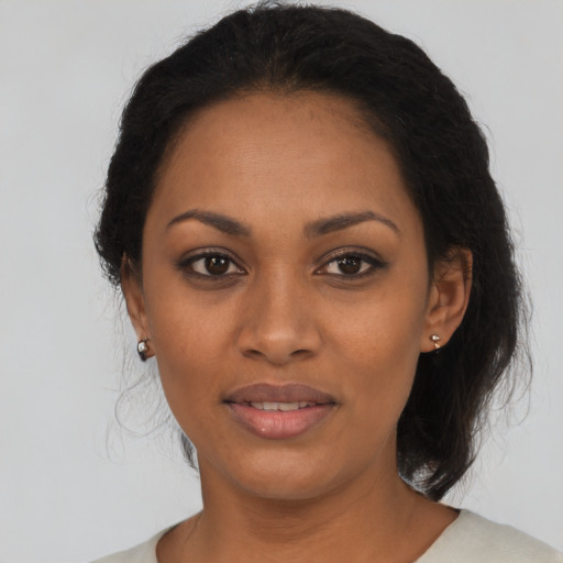 Joyful latino young-adult female with medium  black hair and brown eyes