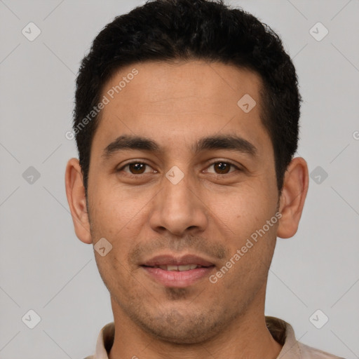 Joyful latino young-adult male with short  black hair and brown eyes