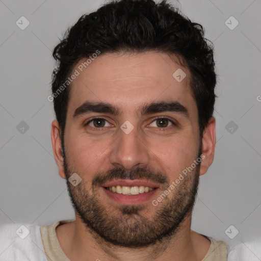 Joyful white young-adult male with short  black hair and brown eyes