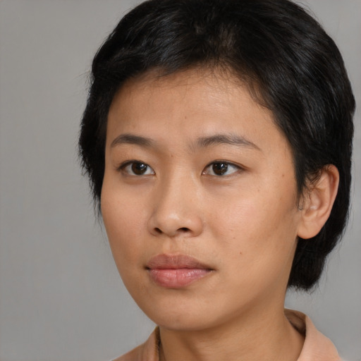 Neutral asian young-adult female with medium  brown hair and brown eyes