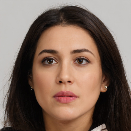 Neutral latino young-adult female with long  brown hair and brown eyes