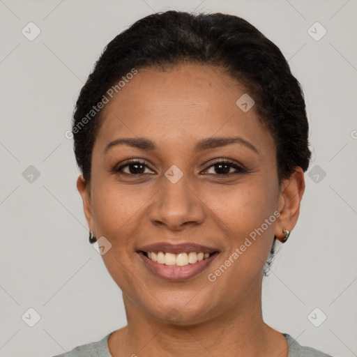 Joyful latino adult female with short  black hair and brown eyes