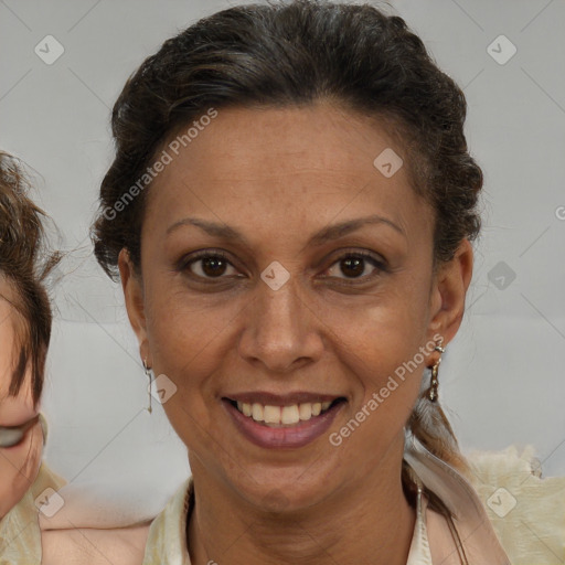 Joyful black adult female with medium  brown hair and brown eyes