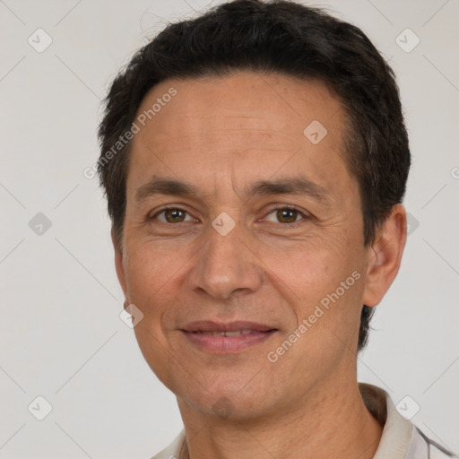 Joyful white adult male with short  brown hair and brown eyes