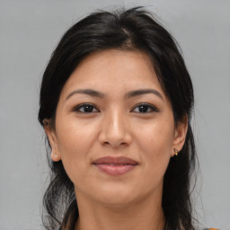 Joyful asian young-adult female with medium  brown hair and brown eyes