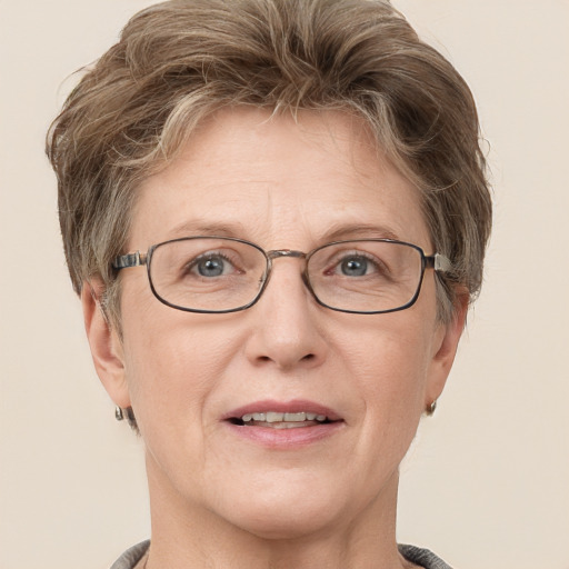 Joyful white middle-aged female with short  brown hair and grey eyes