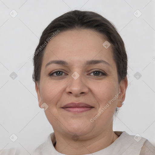 Joyful white adult female with short  brown hair and brown eyes