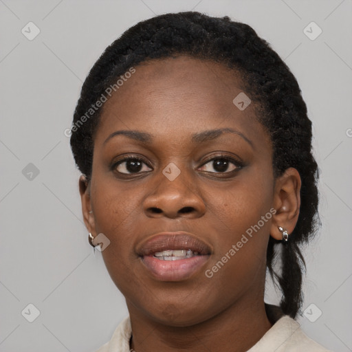 Joyful black young-adult female with short  black hair and brown eyes