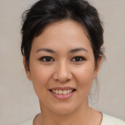 Joyful asian young-adult female with medium  brown hair and brown eyes