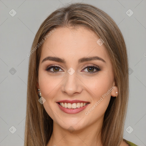 Joyful white young-adult female with long  brown hair and green eyes