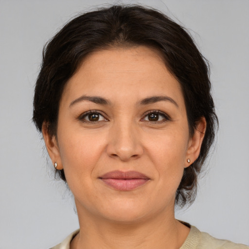 Joyful white adult female with medium  brown hair and brown eyes