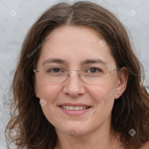 Joyful white adult female with long  brown hair and brown eyes