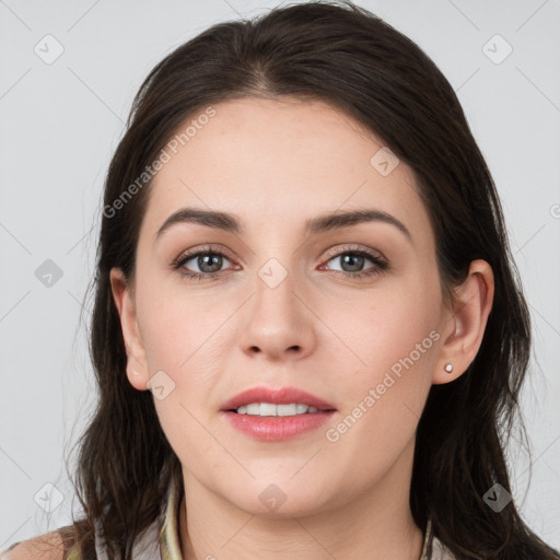 Joyful white young-adult female with long  brown hair and grey eyes