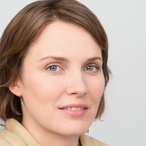 Joyful white young-adult female with medium  brown hair and blue eyes