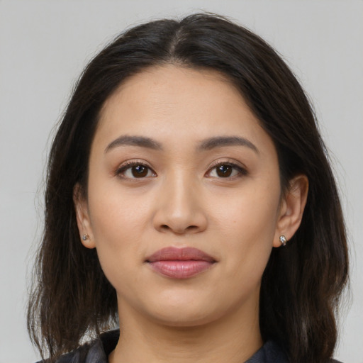 Joyful white young-adult female with medium  brown hair and brown eyes