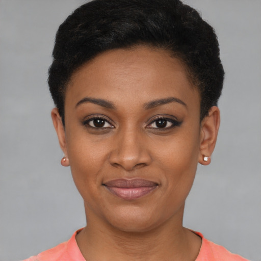 Joyful black young-adult female with short  brown hair and brown eyes