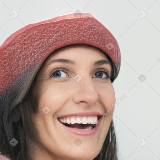 Joyful white young-adult female with long  brown hair and blue eyes