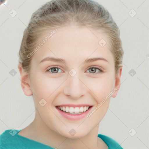 Joyful white young-adult female with short  brown hair and blue eyes