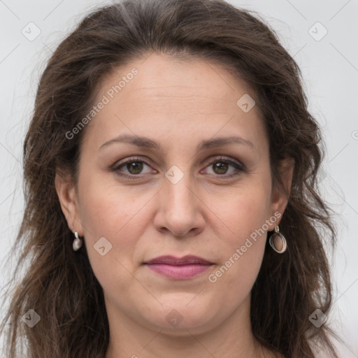 Joyful white adult female with long  brown hair and grey eyes