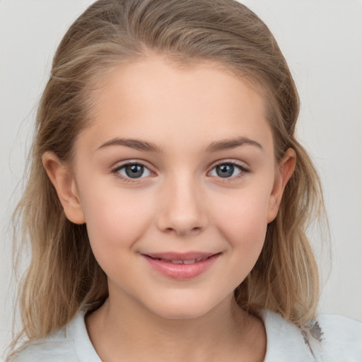 Joyful white child female with medium  brown hair and grey eyes