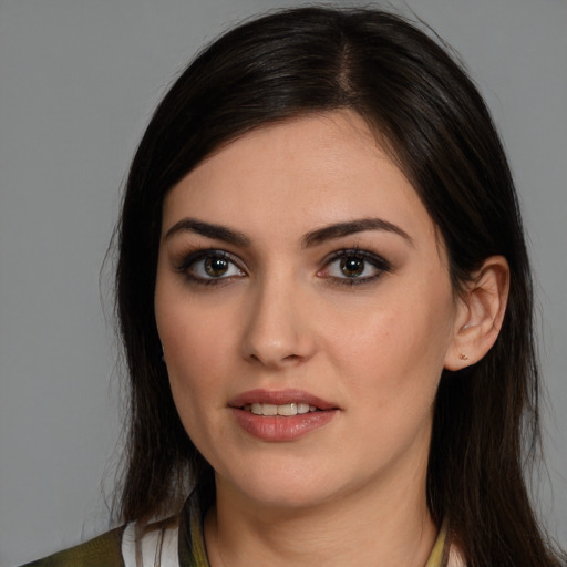 Joyful white young-adult female with long  brown hair and brown eyes