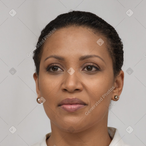 Joyful black young-adult female with short  brown hair and brown eyes