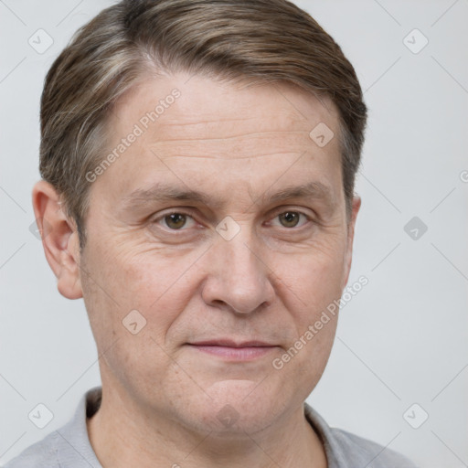 Joyful white adult male with short  brown hair and grey eyes