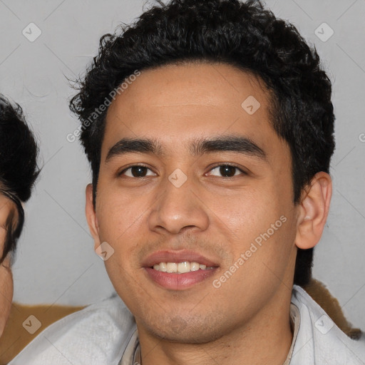 Joyful asian young-adult male with short  black hair and brown eyes