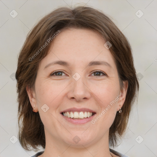 Joyful white adult female with medium  brown hair and grey eyes